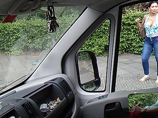 Two women are interested in jerking off a man in the car and look through the window